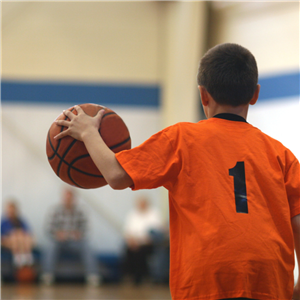 Young boy holds basketball
