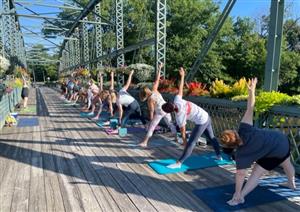 yoga group on the flower bridge