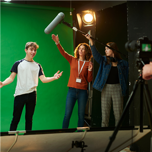 Teenagers film with a green screen