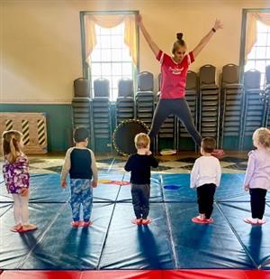 Playstrong instructor teaching 5 children