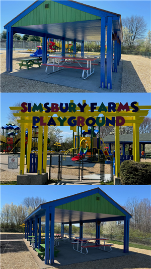 The green and blue pavillion at Simsbury Farms and the yellow entrance sign