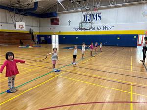 Baton students in line with their batons in th HJMS gym